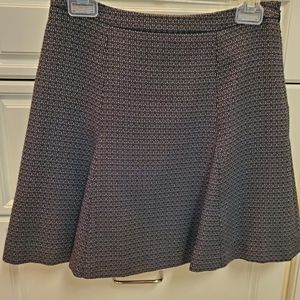 Tweed skirt, flare bottom, side zip and lined.